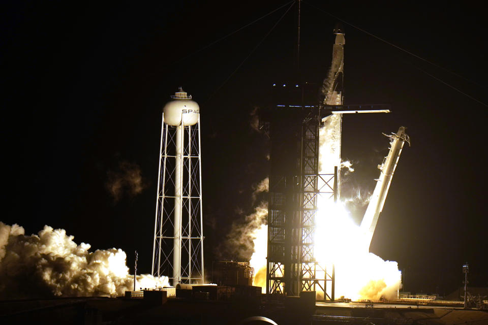 A SpaceX Falcon9 rocket, with the Crew Dragon capsule attached, lift's off from Kennedy Space Center's Launch Complex 39-A Sunday Nov. 15, 2020, in Cape Canaveral, Fla. Four astronauts are beginning a mission to the international Space Station. (AP Photo/Chris O'Meara)