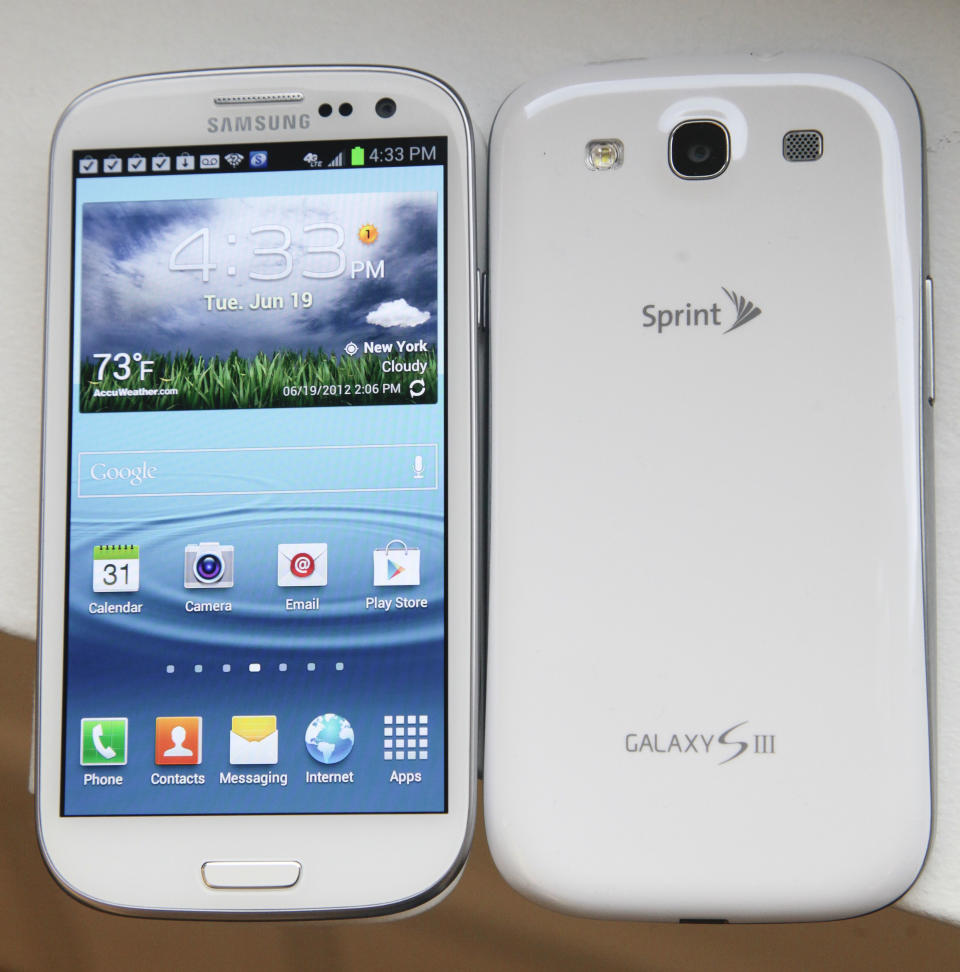 This June 19, 2012 photo shows the front and back of Samsung’s new Galaxy S III phone, in New York. The Galaxy S III, which looks and feels like an oversized iPhone, is available next week. (AP Photo/Bebeto Matthews)