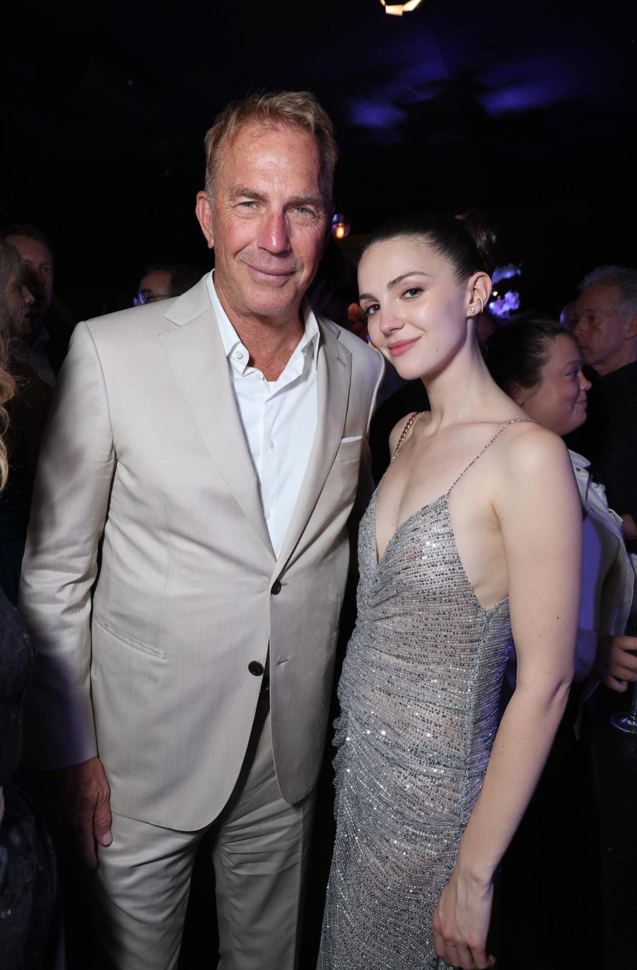 Kevin Costner and Ella Hunt posing together