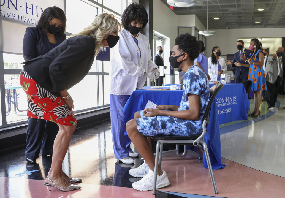 First lady Jill Biden talks to a COVID-19 vaccination recipient at a COVID-19 clinic at Jackson State University in Jackson, Miss., Tuesday, June 22, 2021. (Tom Brenner/Pool via AP)