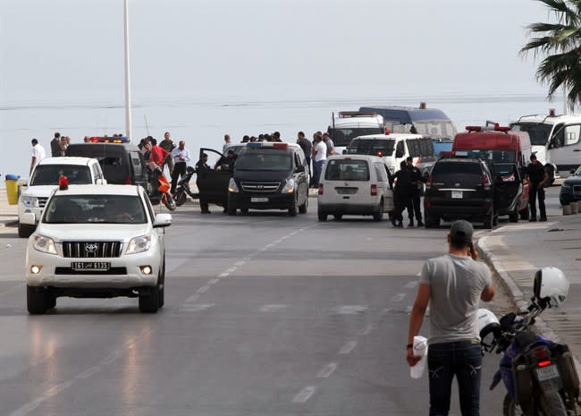 Tunisian police officers secure the place where a suicide bomber blew himself up near a seaside hotel in Sousse,Tunisia, Wednesday, Oct. 30, 2013. The attack was believed to be the country's first suicide bombing. Witnesses told Tunisian media that the suicide bomber appeared to be about to enter the Riadh Palm hotel in Sousse, about 90 miles (150 kilometers) south of the capital, Tunis, when there was an explosion. The Interior Ministry said that no one else was injured and no property was damaged. It said the bomber was a Tunisian man wearing an explosive belt. (AP Photo/Raghda Jammali)