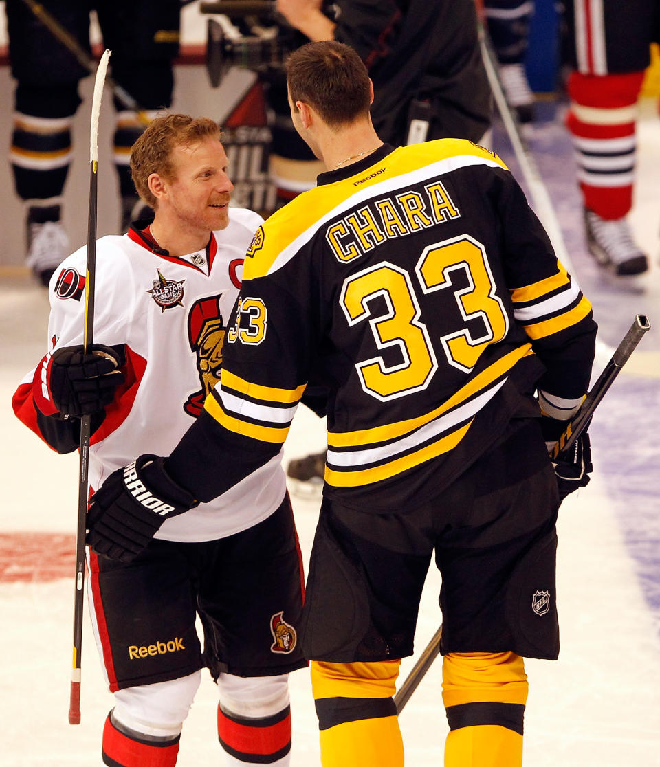 OTTAWA, ON - JANUARY 28: Zdeno Chara #33 of the Boston Bruins and Team Chara and Team Chara talks with Daniel Alfredsson #11 of the Ottawa Senators and Team Alfredsson during the Blackberry NHL Hardest Shot part of the 2012 Molson Canadian NHL All-Star Skills Competition at Scotiabank Place on January 28, 2012 in Ottawa, Ontario, Canada. (Photo by Gregory Shamus/Getty Images)