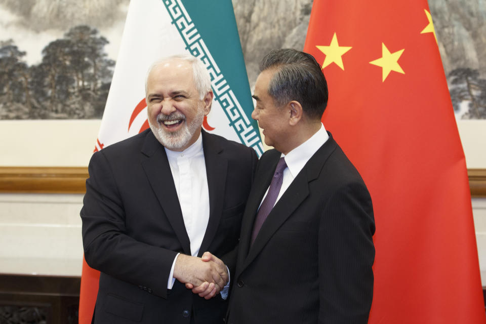 Chinese Foreign Minister Wang Yi meets Iranian Foreign Minister Mohammad Javad Zarif at the Diaoyutai State Guesthouse in Beijing, Friday, May 17, 2019. (Thomas Peter/Pool Photo via AP)