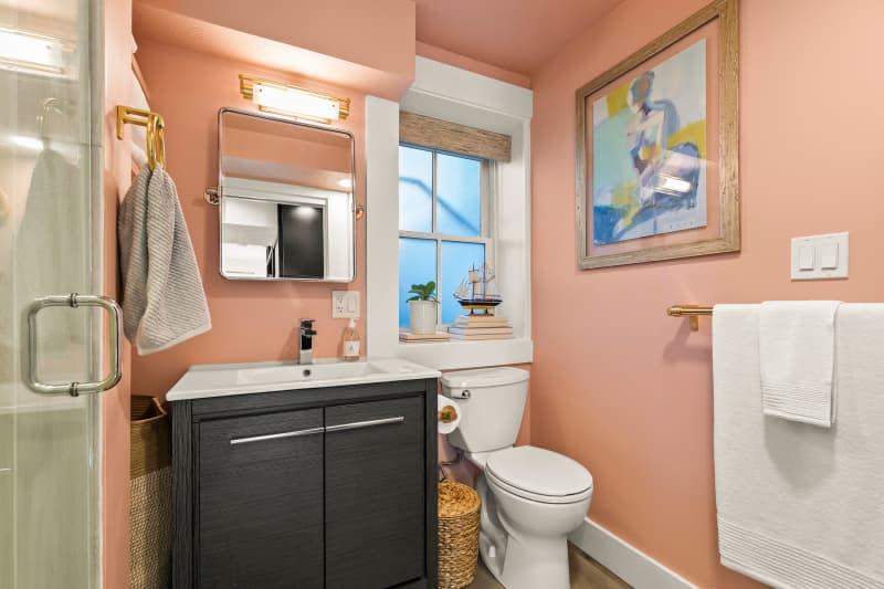 Pink bathroom in studio apartment.