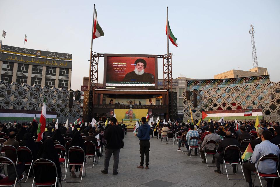 People gather in the Imam Hussein square in Tehran, during the televised speech of Lebanese Hezbollah chief Hassan Nasrallah Nov. 3, 2023. Nasrallah told the United States on Nov. 3, that his Iran-backed group was ready to face its warships and the way to prevent a regional war was to halt the attacks in Gaza.
