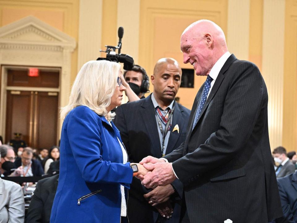 Arizona House Speaker Rusty Bowers greets January 6 committee vice chair Rep. Liz Cheney of Wyoming following his testimony on June 21, 2022.