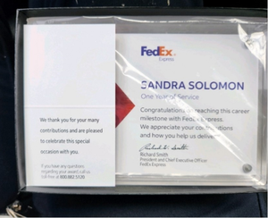 Solomon's award for completing her first year of safe driving with FedEx.