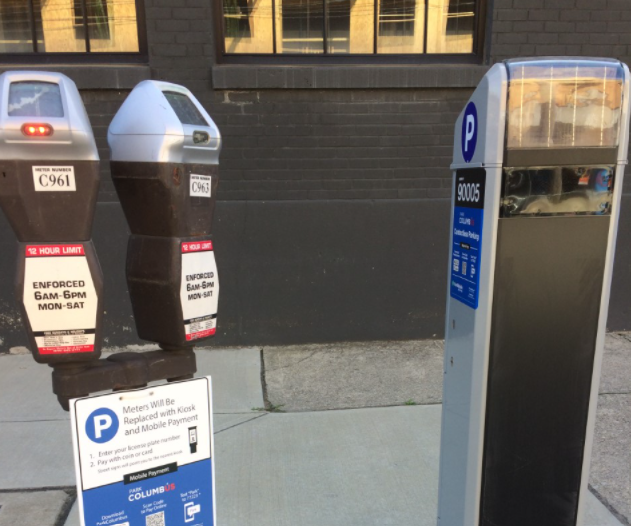 The City of Columbus has replaced meters, left, with payment kiosks, right, or Park Columbus app signs in many areas of the city.