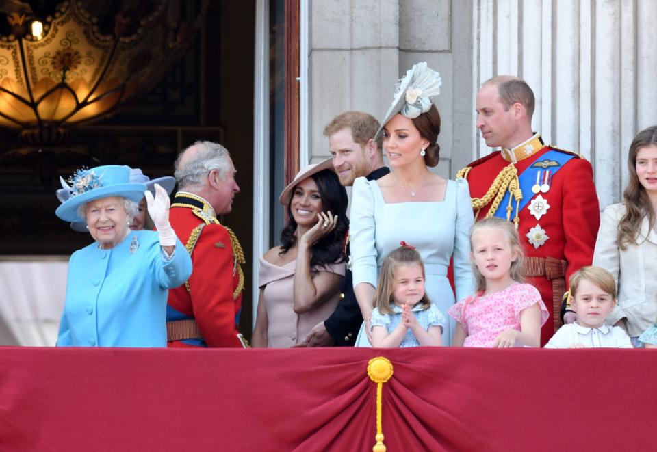 <p>Meghan and Harry stood just behind Will, Kate, and the children on the balcony.</p>