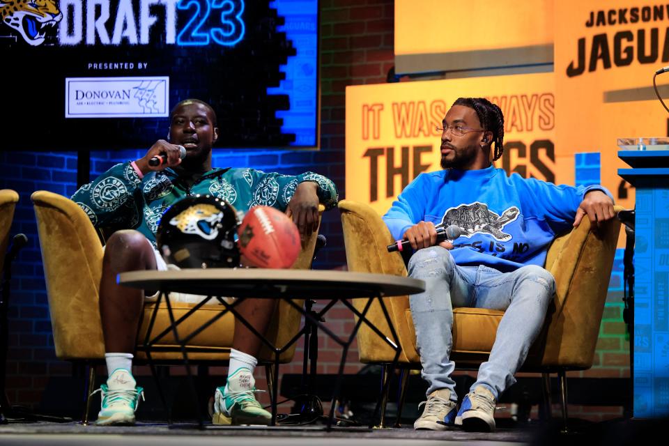 Jacksonville Jaguars inside linebacker Foye Oluokun, left, speaks, as safety Andre Cisco looks on during an NFL Draft watch party Thursday, April 27, 2023 at TIAA Bank Field’s Daily’s Place in Jacksonville, Fla. The Jacksonville Jaguars selected, with the 27th pick, offensive tackle Anton Harrison from Oklahoma. [Corey Perrine/Florida Times-Union]