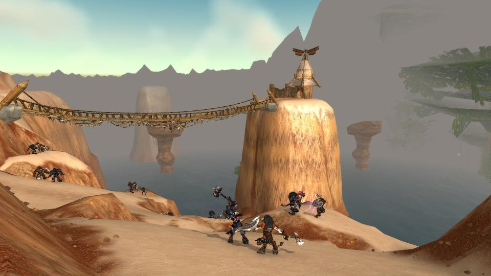 A group of WoW Classic players cross a sandy bridge