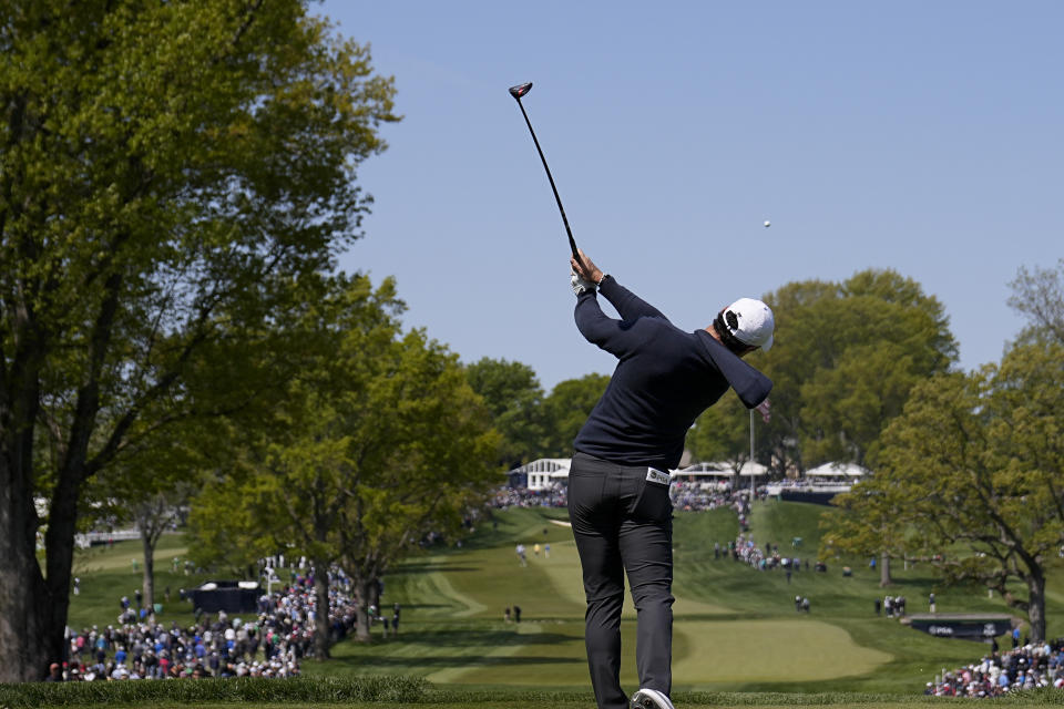 Rory McIlroy, of Northern Ireland, watches his tee shot on the 13th hole during the first round of the PGA Championship golf tournament at Oak Hill Country Club on Thursday, May 18, 2023, in Pittsford, N.Y. (AP Photo/Eric Gay)