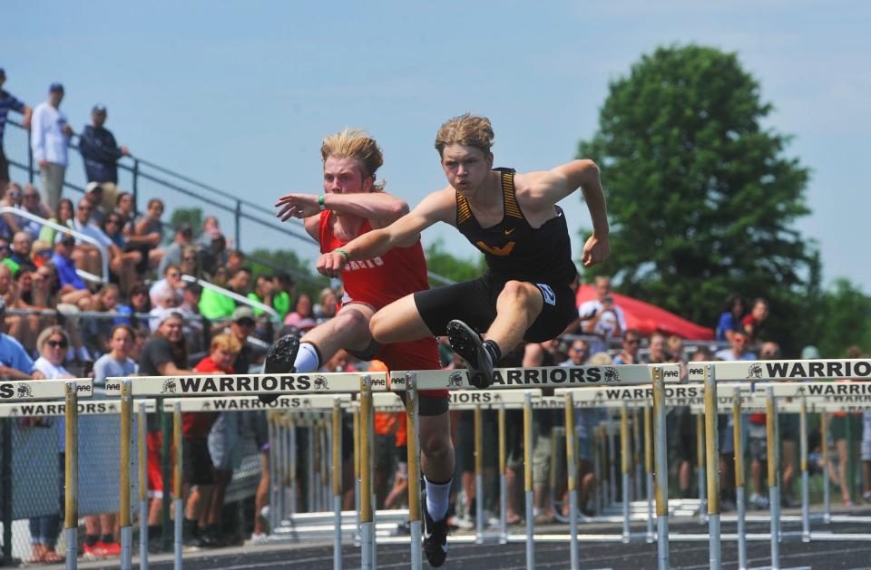 Colonel Crawford's Trevor Vogt competes in the second heat of the 110 hurdles preliminaries at the Division III state track and field championships.