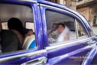 In Cuba, most weddings are civil ceremonies. This just-married couple prepare to run off in their purple car after being married at the Palacio de Matrimonios in Central Havana, where the ceremonies take 15 minutes.