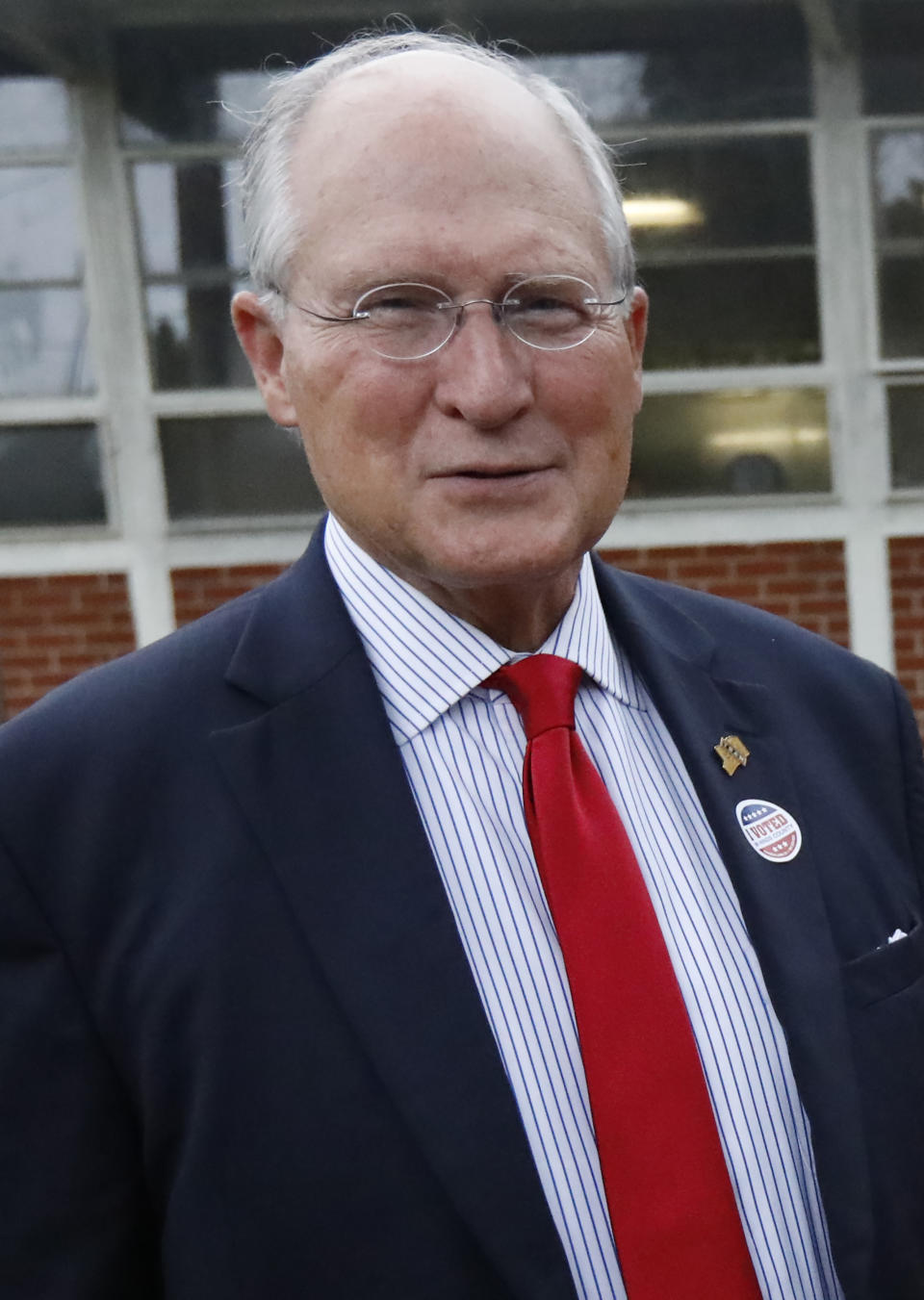 Former Mississippi Supreme Court Chief Justice Bill Waller Jr., speaks to reporters about his hopes for a big turnout of supporters in his runoff race against Lt. Governor Tate Reeves for the GOP nomination for governor, Tuesday, Aug. 27, 2019 at his Jackson, Miss., voting precinct. (AP Photo/Rogelio V. Solis)