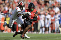 Cincinnati wide receiver Tre Tucker, right, makes a catch against Indiana defensive back Josh Sanguinetti during the first half of an NCAA college football game, Saturday, Sept. 24, 2022, in Cincinnati. (AP Photo/Aaron Doster)