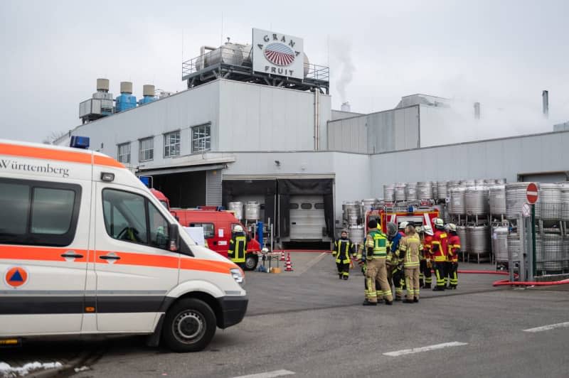 Firefighters are deployed to secure the hazardous goods container after a chemical accident in Constance. Silas Stein/dpa