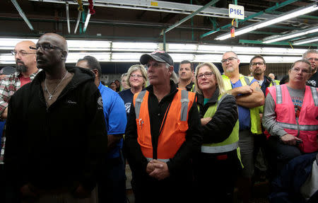 Ford Motor Co. assembly workers listen during a news conference as Ford president and CEO Mark Fields makes a major announcement at the Flat Rock Assembly Plant in Flat Rock, Michigan, U.S. January 3, 2017. REUTERS/Rebecca Cook