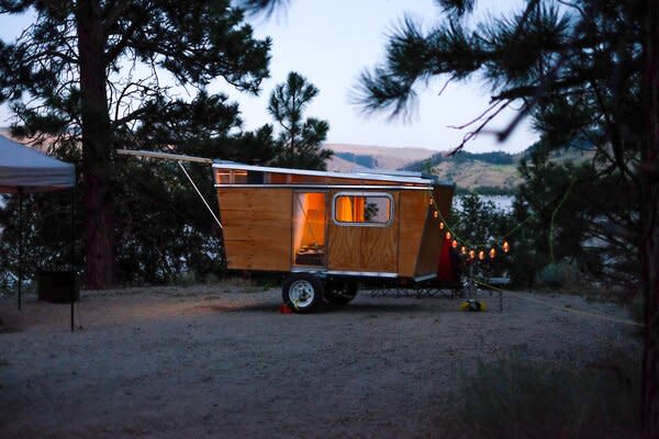 Nicknamed the Wooden Wedge, the camper is small enough to fit in a parking space or driveway but roomy enough to sleep two. 