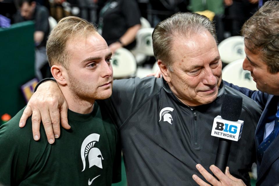 Michigan State's Steven Izzo, left, hugs his father coach Tom Izzo while getting interviewed after MSU's win over Northwestern on Wednesday, March 6, 2024, at the Breslin Center in East Lansing.