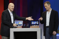 Microsoft CEO Steve Ballmer, left, and Qualcomm CEO Paul Jacobs talk about various Windows based products that utilize Qualcomm technology during Jacobs' keynote address at the Consumer Electronics Show.