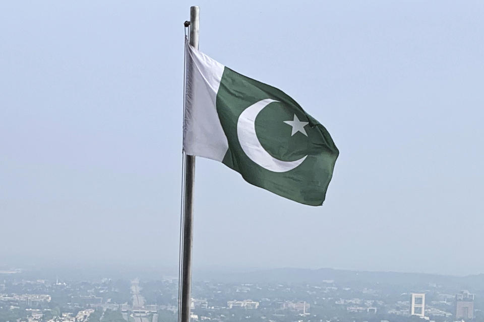 FILE - A Pakistani flag flies on a lookout in Islamabad, Pakistan, on July 27, 2022. Pakistan's air force launched retaliatory airstrikes early Thursday, Jan. 18, 2024, on Iran allegedly targeting militant positions, an attack that killed at least seven people and further raised tensions between the neighboring nations. (AP Photo/Rahmat Gul, File)