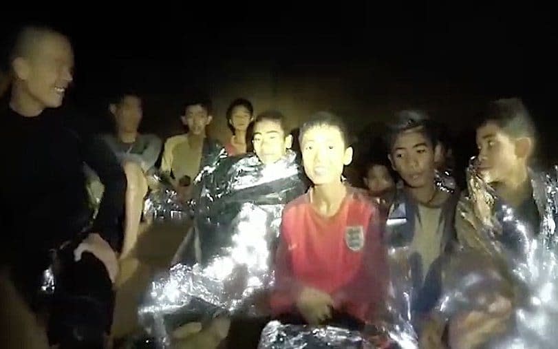 One of the schoolboys trapped deep in the cave network wears an England shirt in an image captured by rescuers - Getty Images AsiaPac