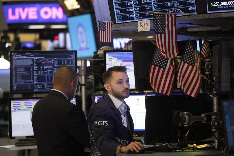 Traders work at the New York Stock Exchange, Friday, July 5, 2019 in New York. (AP Photo/Mark Lennihan)