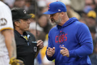 Chicago Cubs manager David Ross, right, talks with home plate umpire Phil Cuzzi after being ejected during the second inning of a baseball game against the San Diego Padres, Monday, June 5, 2023, in San Diego. (AP Photo/Gregory Bull)