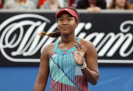 Japan's Naomi Osaka celebrates after winning her second round match against Ukraine's Elina Svitolina at the Australian Open tennis tournament at Melbourne Park, Australia, January 21, 2016. REUTERS/Issei Kato