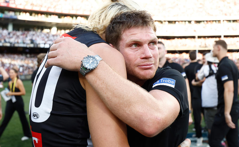 Taylor Adams pictured hugging Darcy Moore