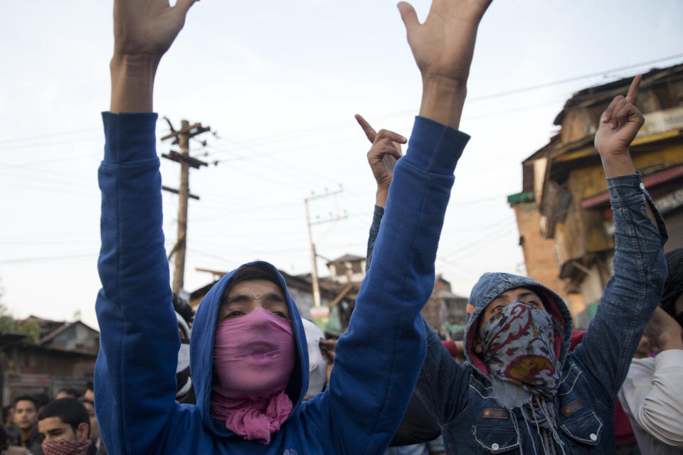 Kashmiri boys shout pro-freedom slogans during a joint funeral of two rebels and a civilian after they were killed in a gunbattle in Srinagar, India, Wednesday, Oct. 17, 2018. Anti-India protests and clashes erupted in the main city in disputed Kashmir on Wednesday after a gunbattle between militants and government forces killed at least two suspected rebels, a civilian and a counterinsurgency police official, residents and police said. (AP Photo/Dar Yasin)