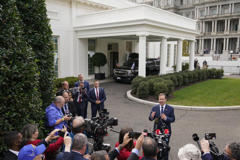 Israel's President Isaac Herzog speaks with members of the press after meeting with President Joe Biden at the White House, Wednesday, Oct. 26, 2022, in Washington. (AP Photo/Patrick Semansky)