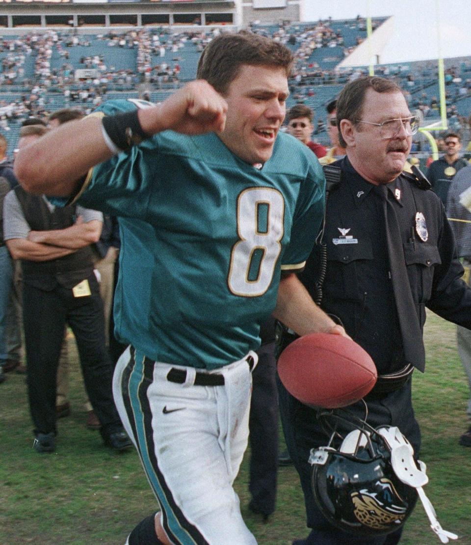 Mark Brunell walks off the field after leading the Jacksonville Jaguars to their first home playoff victory on Jan. 3, 1999, against the New England Patriots.