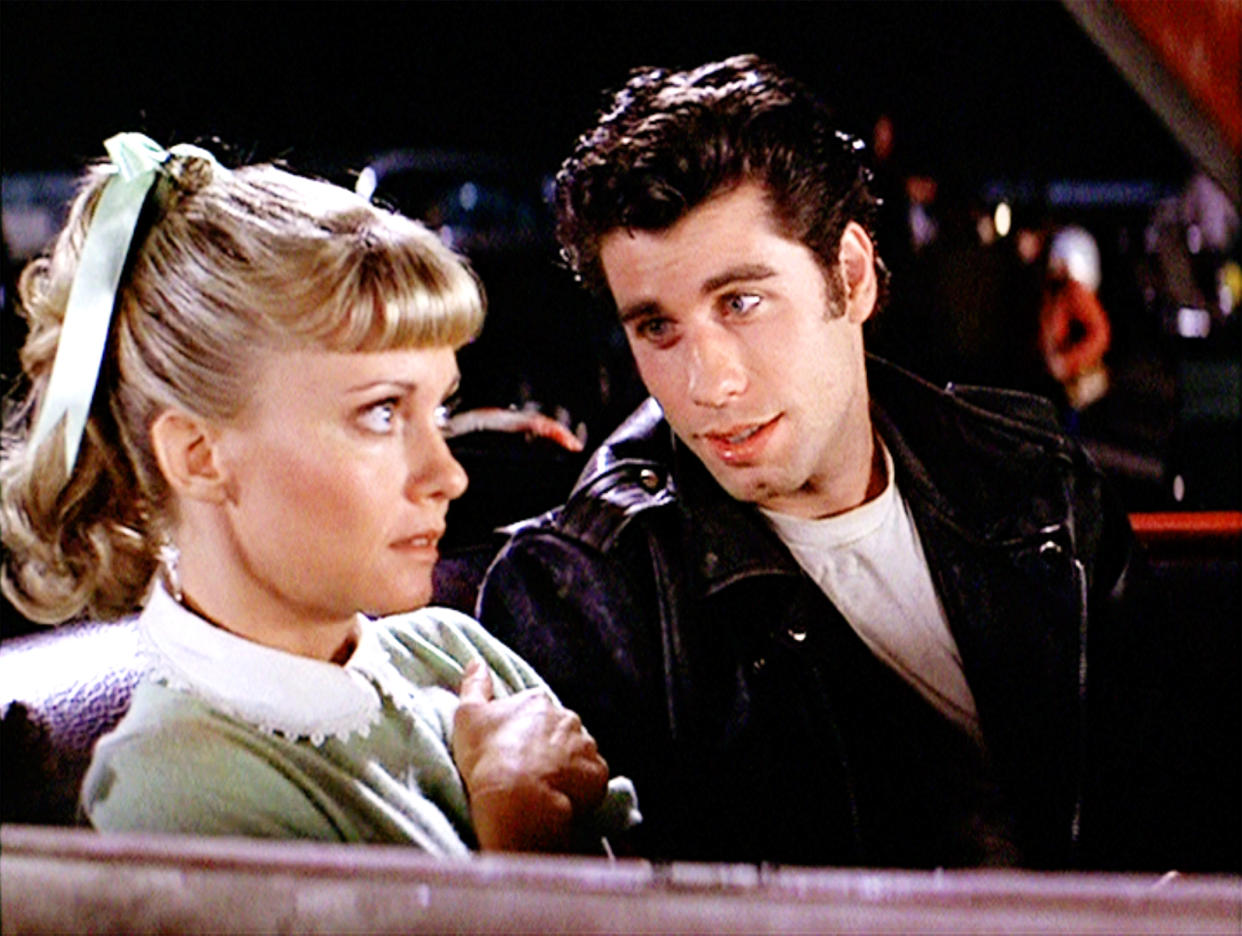 LOS ANGELES - JUNE 16: The movie "Grease", directed by Randal Kleiser. Seen here at the drive-in (from left) Olivia Newton-John as Sandy and John Travolta as Danny Zuko. Initial theatrical release of the film, June 16, 1978. Screen capture. Paramount Pictures. (Photo by CBS via Getty Images)