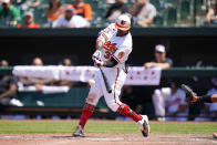 Baltimore Orioles' Cedric Mullins connects for a solo home run against the Texas Rangers during the fifth inning of a baseball game, Monday, July 4, 2022, in Baltimore. The Orioles won 7-6 in ten innings. (AP Photo/Julio Cortez)