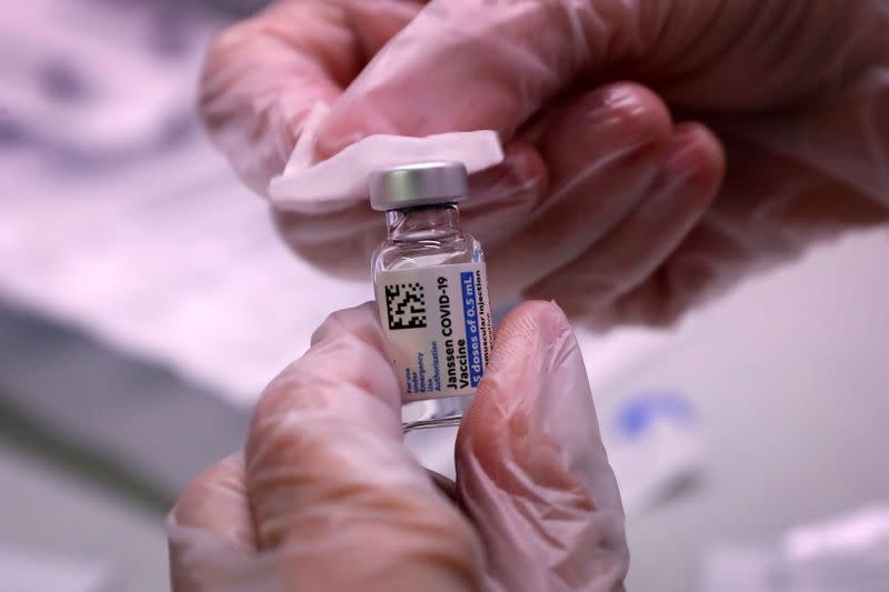 FILE PHOTO: People receive vaccinations for the coronavirus disease (COVID-19) at subway station in Queens borough of New York City