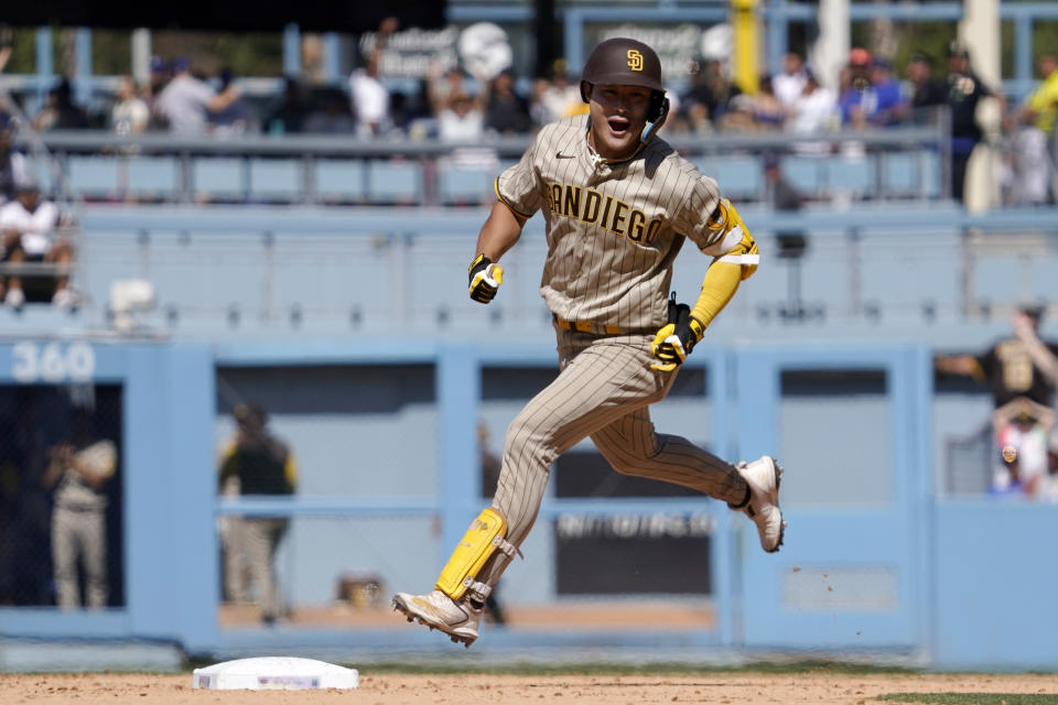 San Diego Padres' Ha-Seong Kim celebrates as he rounds first after hitting a two-run home run during the ninth inning of a baseball game against the Los Angeles Dodgers Sunday, July 3, 2022, in Los Angeles. (AP Photo/Mark J. Terrill)