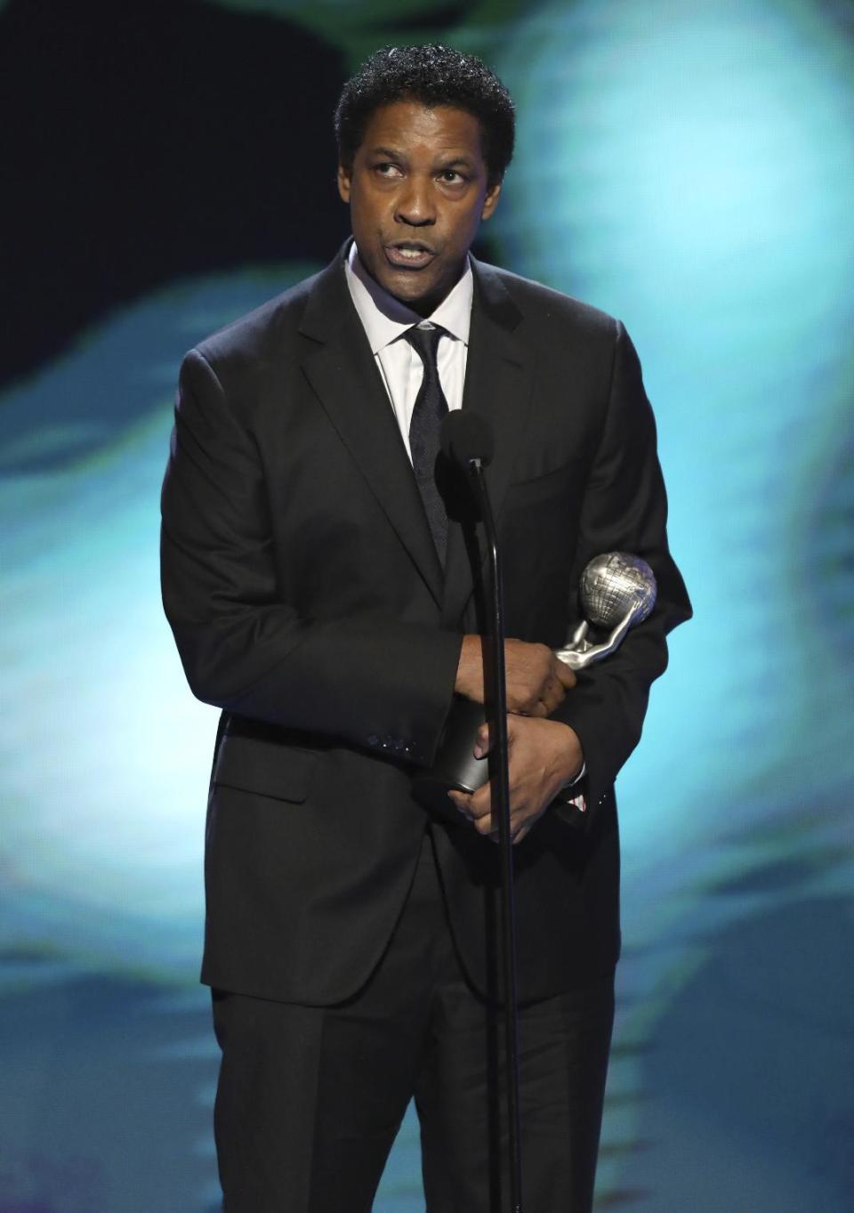 Denzel Washington accepts the award for outstanding actor in a motion picture for "Fences" at the 48th annual NAACP Image Awards at the Pasadena Civic Auditorium on Saturday, Feb. 11, 2017, in Pasadena, Calif. (Photo by Matt Sayles/Invision/AP)
