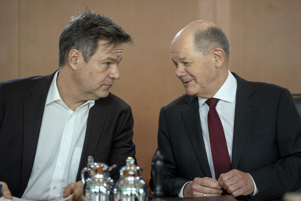 German Chancellor Olaf Scholz, right, speaks with German Economy and Climate Minister Robert Habeck, left, prior to the cabinet meeting of the German government at the chancellery in Berlin, Germany, Wednesday, Jan. 17, 2024. (AP Photo/Ebrahim Noroozi)