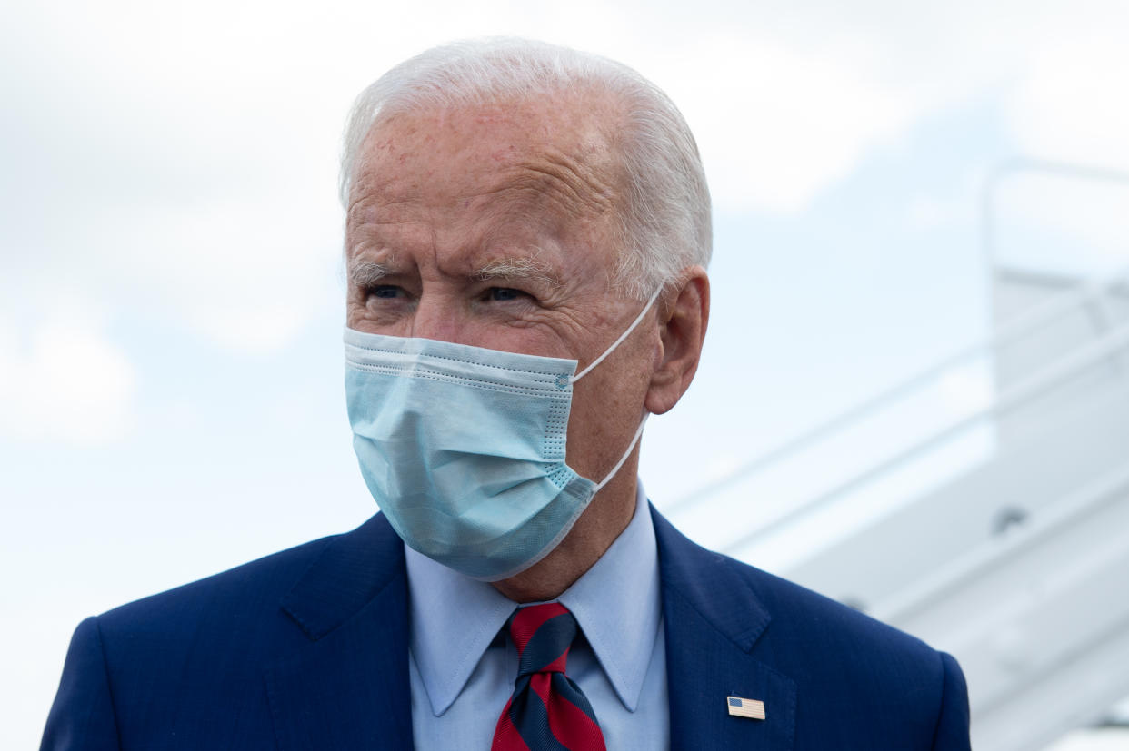 Democratic presidential nominee and former Vice President Joe Biden speaks to journalists before boarding his plane at a local airport in Wilmington, Delaware as he begins a one-day campaign trip to Florida on October 5, 2020. (Photo by ROBERTO SCHMIDT / AFP) (Photo by ROBERTO SCHMIDT/AFP via Getty Images)