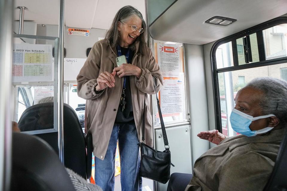 Marilyn Horndt is greeted as she boards the Senior Access van to go to an H-E-B in Round Rock. "We laugh. We giggle," she says of the people she meets on the van rides. "We just sit there and talk."