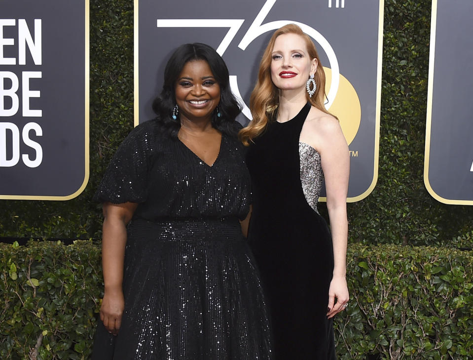 FILE - This Jan. 7, 2018 file photo shows Octavia Spencer, left, and Jessica Chastain at the 75th annual Golden Globe Awards in Beverly Hills, Calif. Spencer opened Chastain's eyes to pay disparity for women of color, the African-American actress said during a Sundance Film Festival panel last year. Chastain vowed to make things right on her film and the result, Spencer said, was an increase of five times in what she'd expected. (Photo by Jordan Strauss/Invision/AP, File)