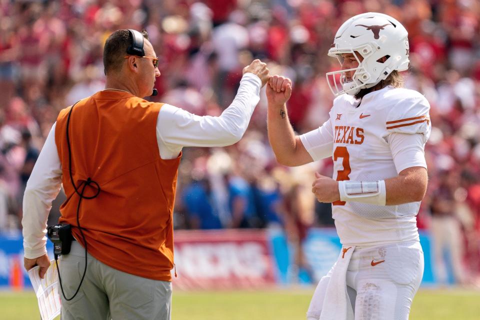Texas coach Steve Sarkisian has full faith in quarterback Quinn Ewers, right, who will lead the Longhorns against Washington in the Sugar Bowl on New Year's Day with a spot in the national championship game on the line.
