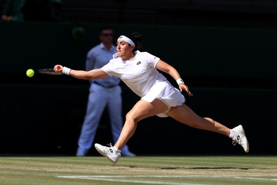 LONDON, ENGLAND - JULY 09: Ons Jabeur (TUN) stretches for the ball during her Ladies' Singles Final match against Elena Rybakina (KAZ) during day thirteen of The Championships Wimbledon 2022 at All England Lawn Tennis and Croquet Club on July 9, 2022 in London, England. (Photo by Simon Stacpoole/Offside/Offside via Getty Images)