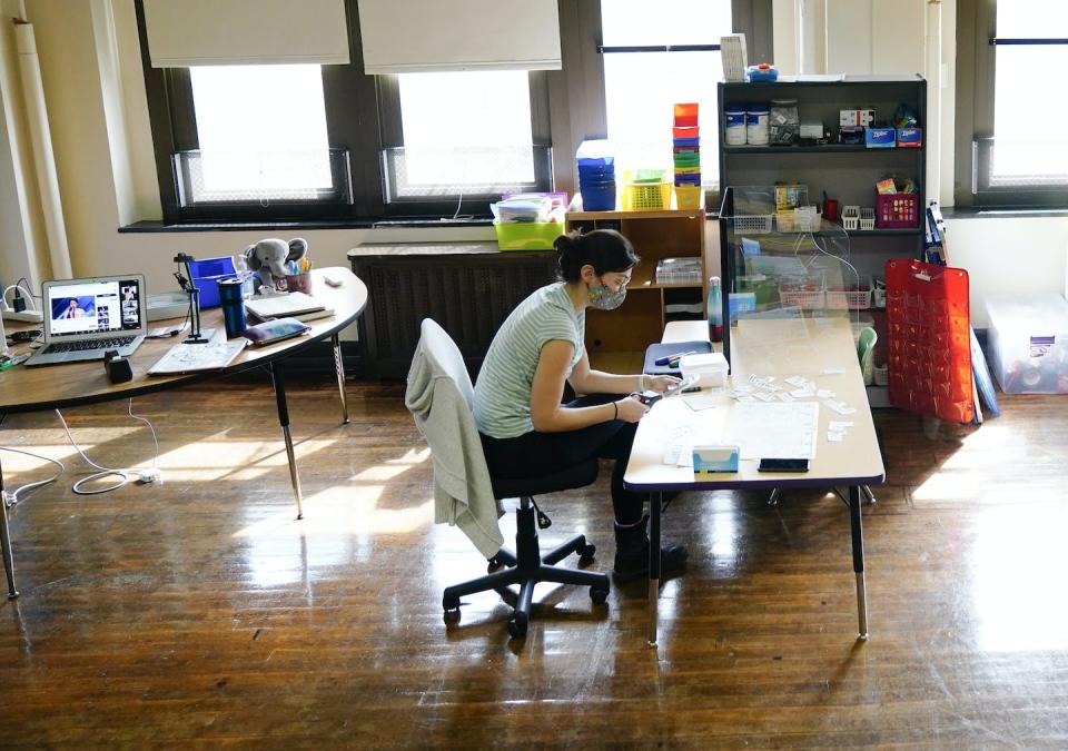 A teacher sits in her classroom. (AP Photo/Matt Rourke)