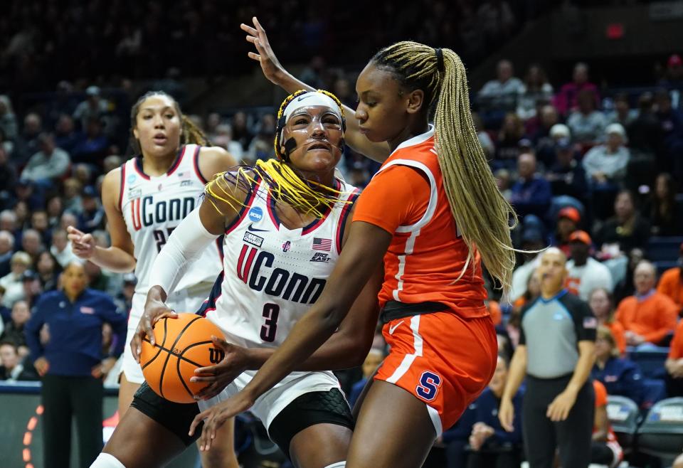 UConn Huskies forward Aaliyah Edwards (3) works the ball against Syracuse Orange forward Alyssa Latham (23) in the first half at Harry A. Gampel Pavilion on March 25, 2024, in Storrs, Connecticut.