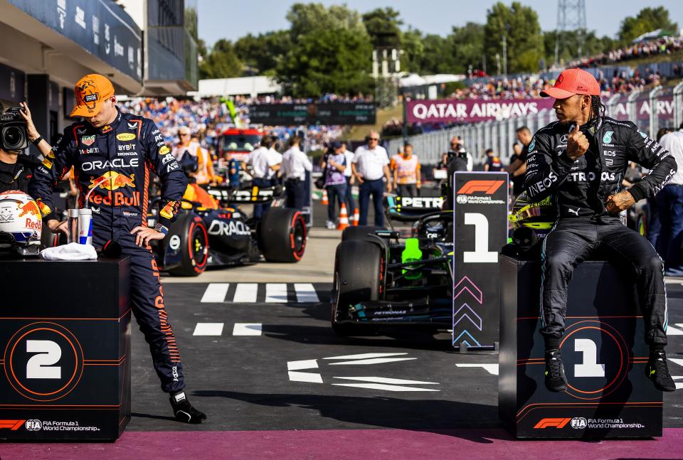 BUDAPEST - Max Verstappen (Red Bull Racing) and Lewis Hamilton (Mercedes) after qualifying at the Hungaroring Circuit in the run-up to the Hungarian Grand Prix. ANP REMKO DE WAAL (Photo by ANP via Getty Images)