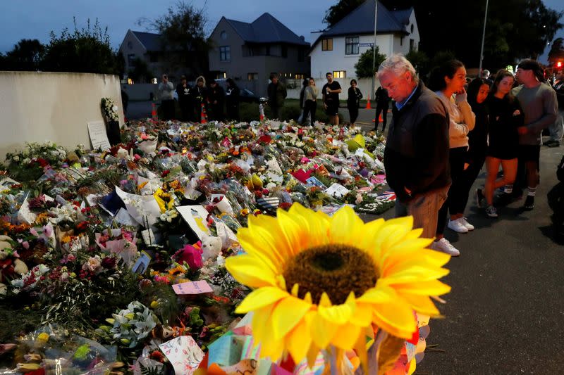 FILE PHOTO: People visit a memorial site for victims of Friday's shooting, in front of the Masjid Al Noor mosque in Christchurch