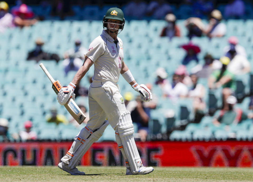 Australia's Steve Smith walks from the field after he was dismissed on 81 runs during play on day four of the third cricket test between India and Australia at the Sydney Cricket Ground, Sydney, Australia, Sunday, Jan. 10, 2021. (AP Photo/Rick Rycroft))